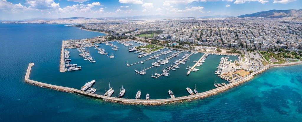 Athens to Paros yacht charter itinerary turquoise beach aerial view Cyclades Greece