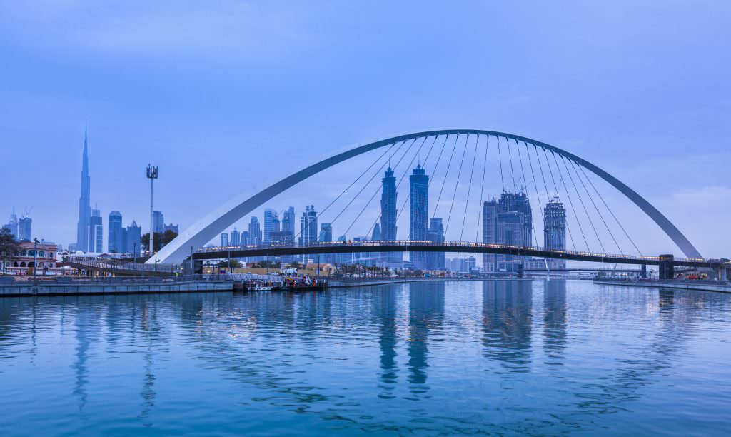 Middle East yacht charter experience Dubai skyline and Water Canal bridge luxury yacht charter destination