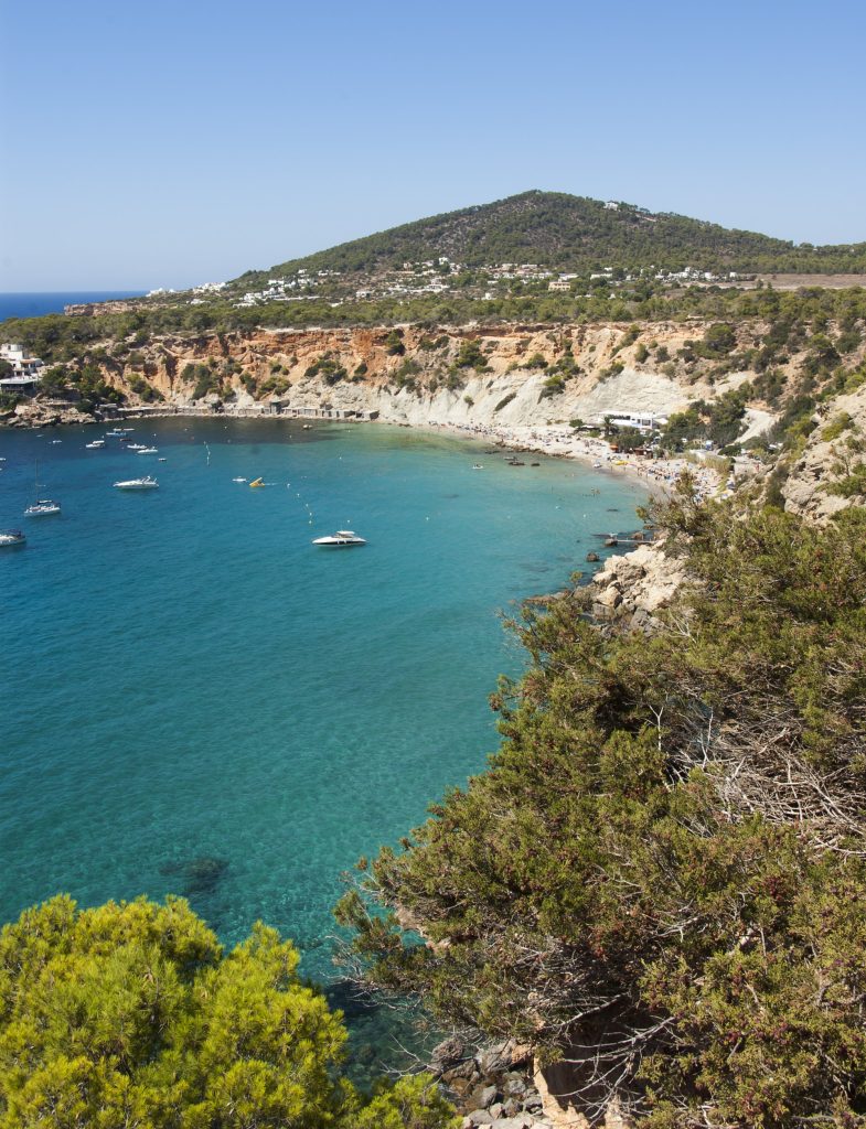 Ibiza yacht charter at Cala Comte beach turquoise water Mediterranean yacht anchorage