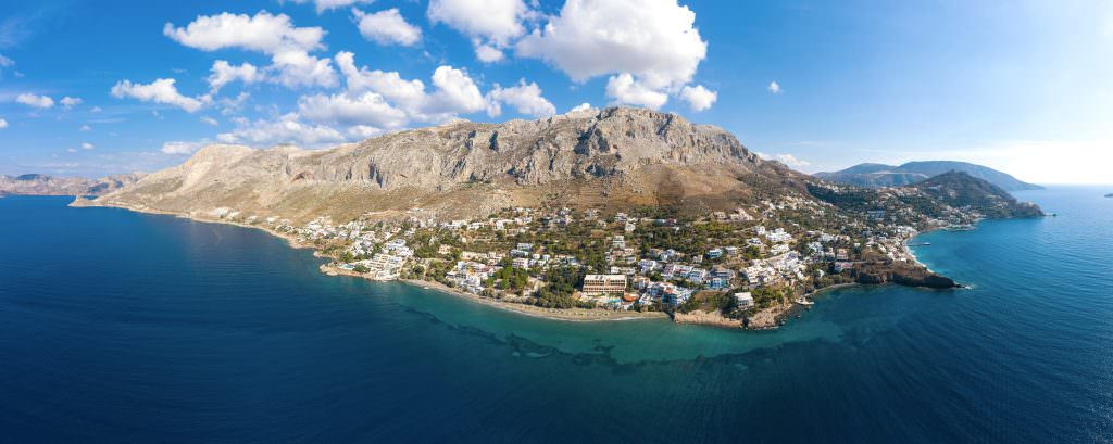 Kalymnos yacht charter. Kalymnos island aerial coastline view Greece blue sea rocky coast landscape luxury yacht charter destination