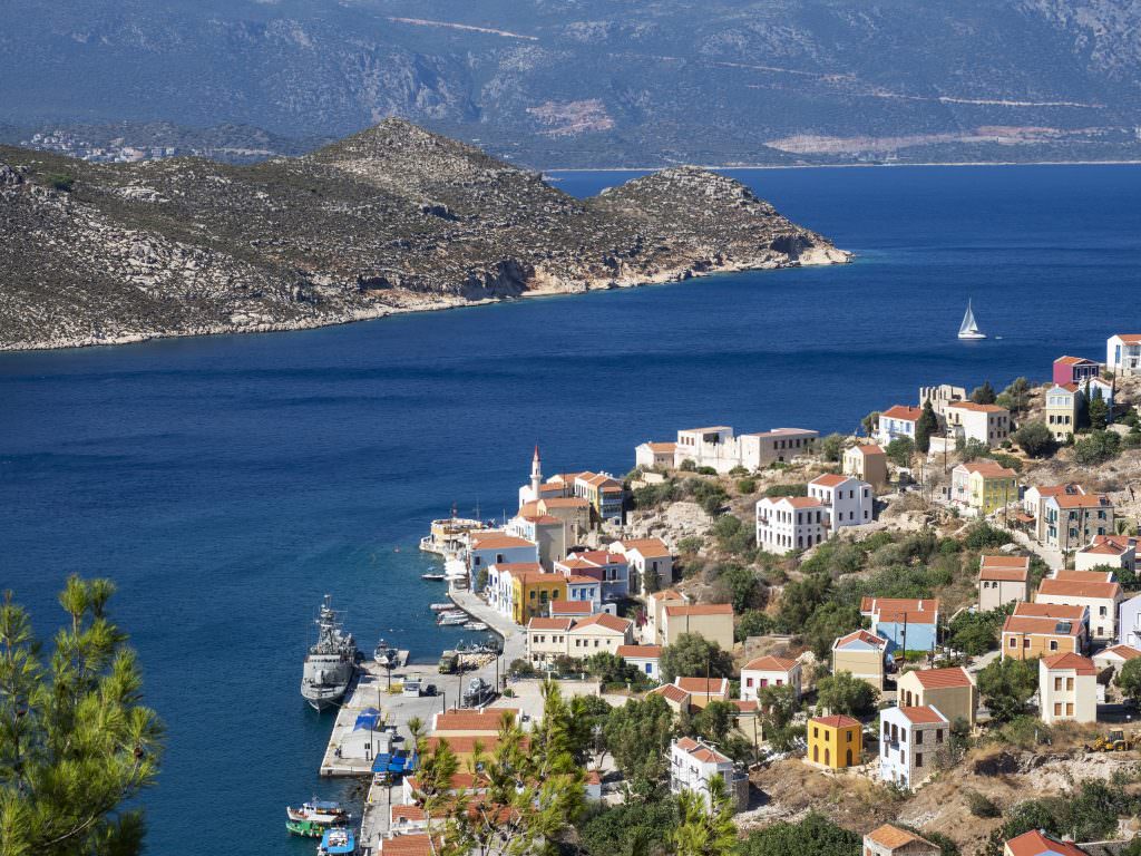 Kastellorizo island marina view Greece colorful houses harbour blue sea coastal village luxury yacht charter destination