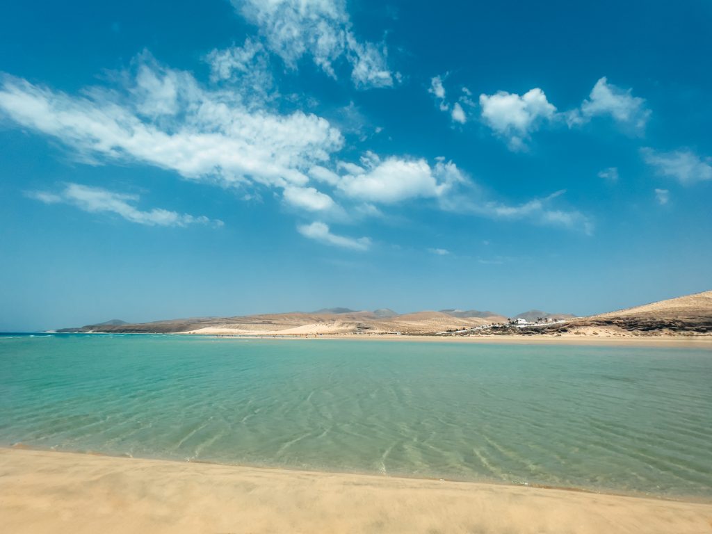 Luxury Oman yacht charter sandy beach with turquoise sea and untouched coastline