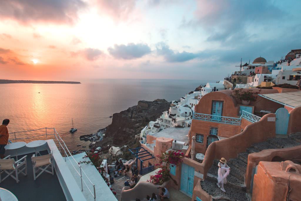 Santorini yacht charter white houses blue sea cliff view luxury Greece
