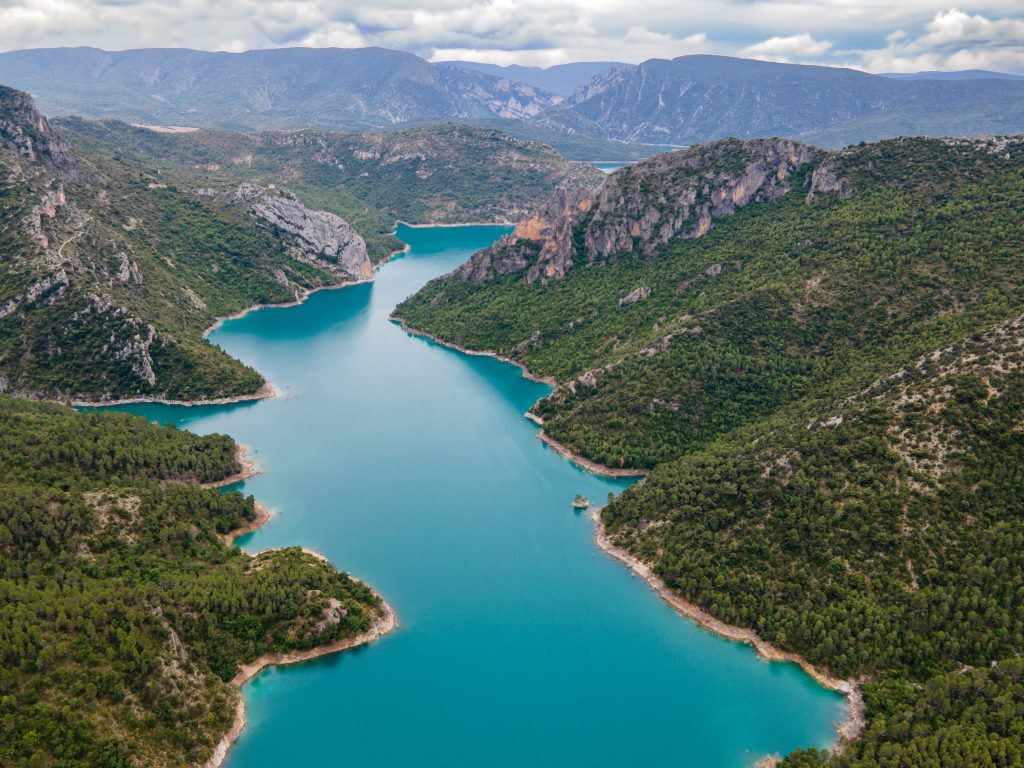 Luxury yacht charter Spain itinerary turquoise canyon lake scenic view