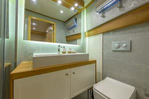Belgin Sultan yacht bathroom modern detail with sink, mirror lighting and elegant luxury yacht interior design