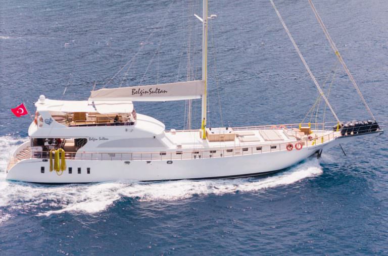 Belgin Sultan yacht charter motor sailor yacht cruising on open sea with elegant design, luxury yacht charter experience