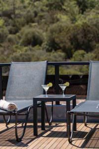 Calm Down luxury yacht charter sun loungers with cocktails on deck in Mediterranean