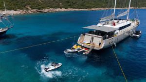 De Love motor sailer water toys and jetski experience, luxury yacht charter lifestyle with swimming platform and turquoise sea