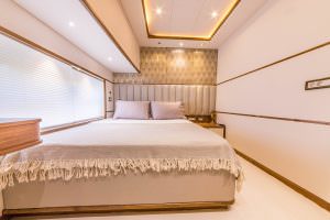 Floki luxury yacht charter master cabin with double bed, elegant lighting and modern interior design