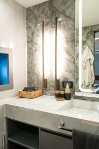 North Wind motor sailer bathroom vanity detail, luxury yacht interior with illuminated mirror, marble surfaces and elegant modern lighting design