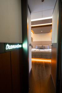North Wind motor sailer cabin entrance, luxury yacht interior showing illuminated hallway, guest cabin doorway and elegant ambient lighting
