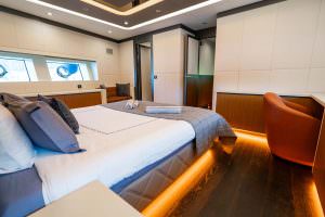 North Wind motor sailer master cabin, luxury yacht suite with spacious layout, elegant furnishings, ambient lighting and modern interior design