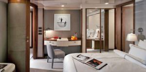 ORIENT STAR yacht luxury cabin with bed, workspace and ensuite bathroom