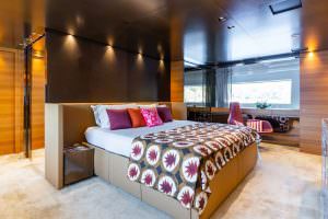 Luxury yacht Takara One master cabin bedroom with king size bed and modern interior design